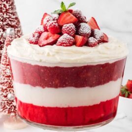close up shot of Christmas Trifle topped with strawberries and raspberries
