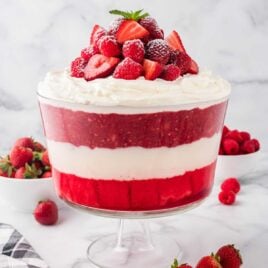 close up shot of Christmas Trifle topped with strawberries and raspberries