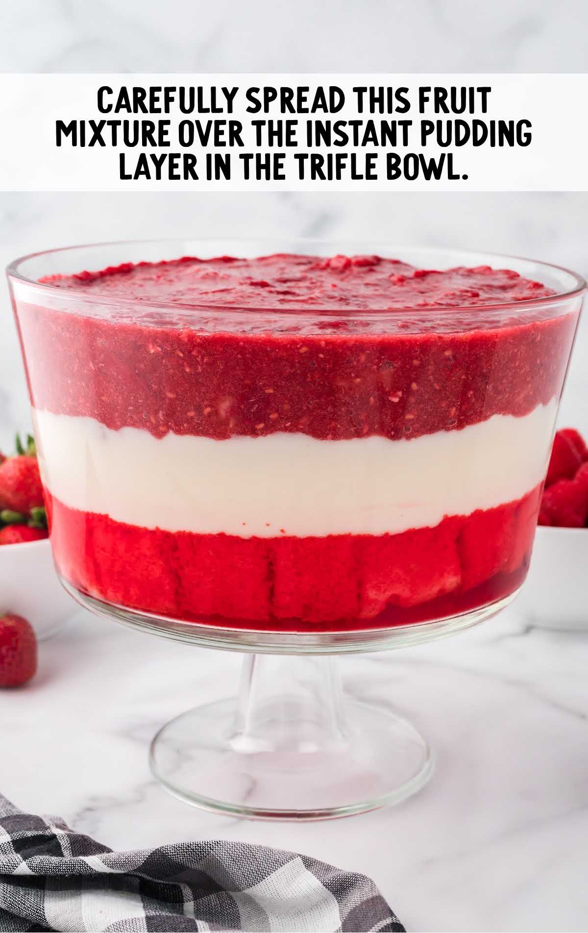 fruit mixture spread over the instant pudding layer in the trifle bowl