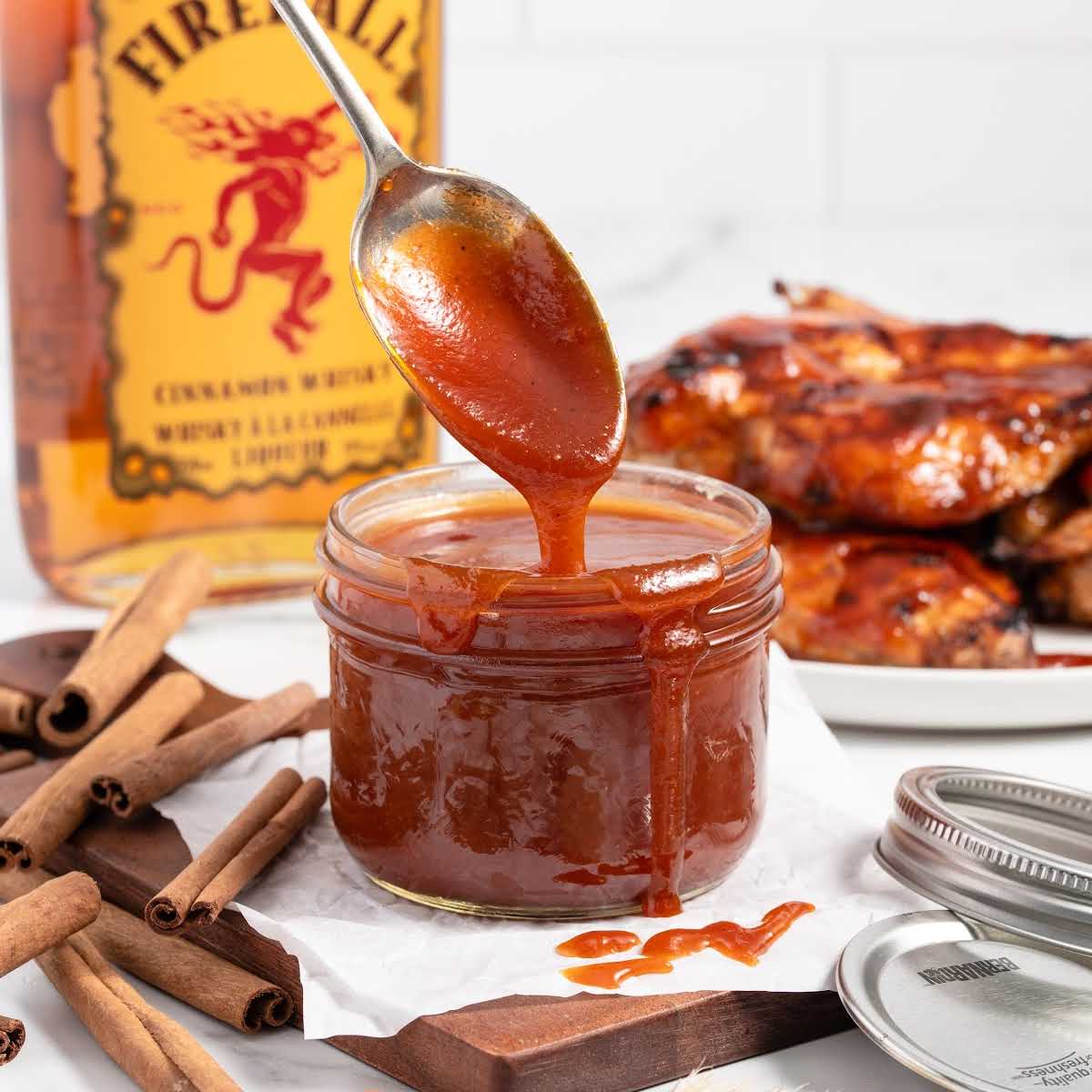 a close up shot of a spooned grabbing Fireball BBQ Sauce