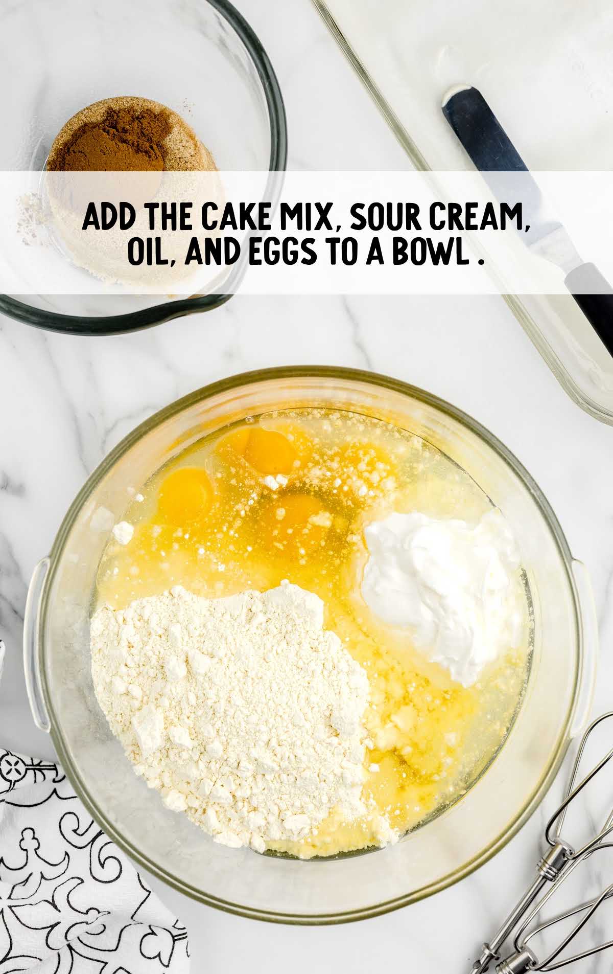cake mix, sour cream, vegetable oil, and eggs combined in a bowl