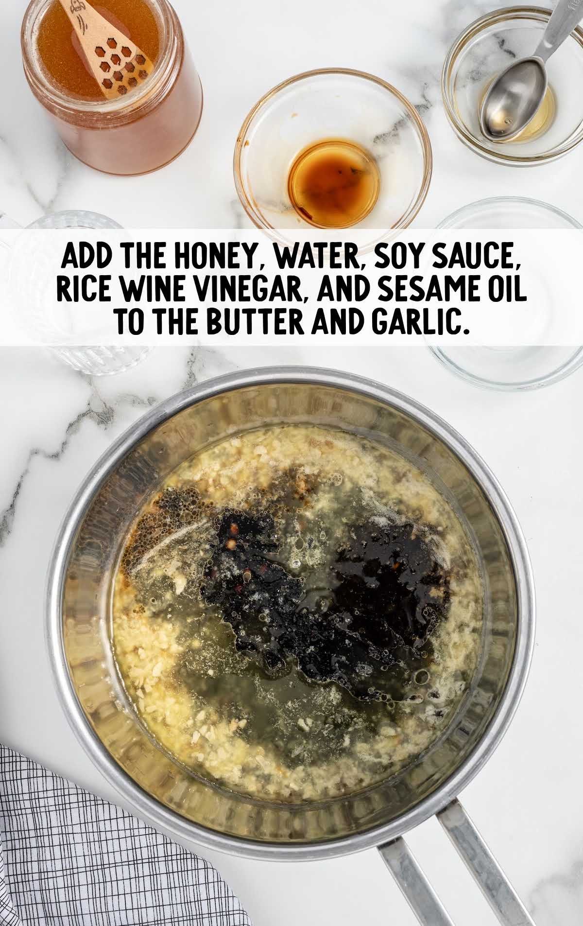 honey, water, low-sodium soy sauce, seasoned rice wine vinegar, and sesame oil added to the butter and garlic