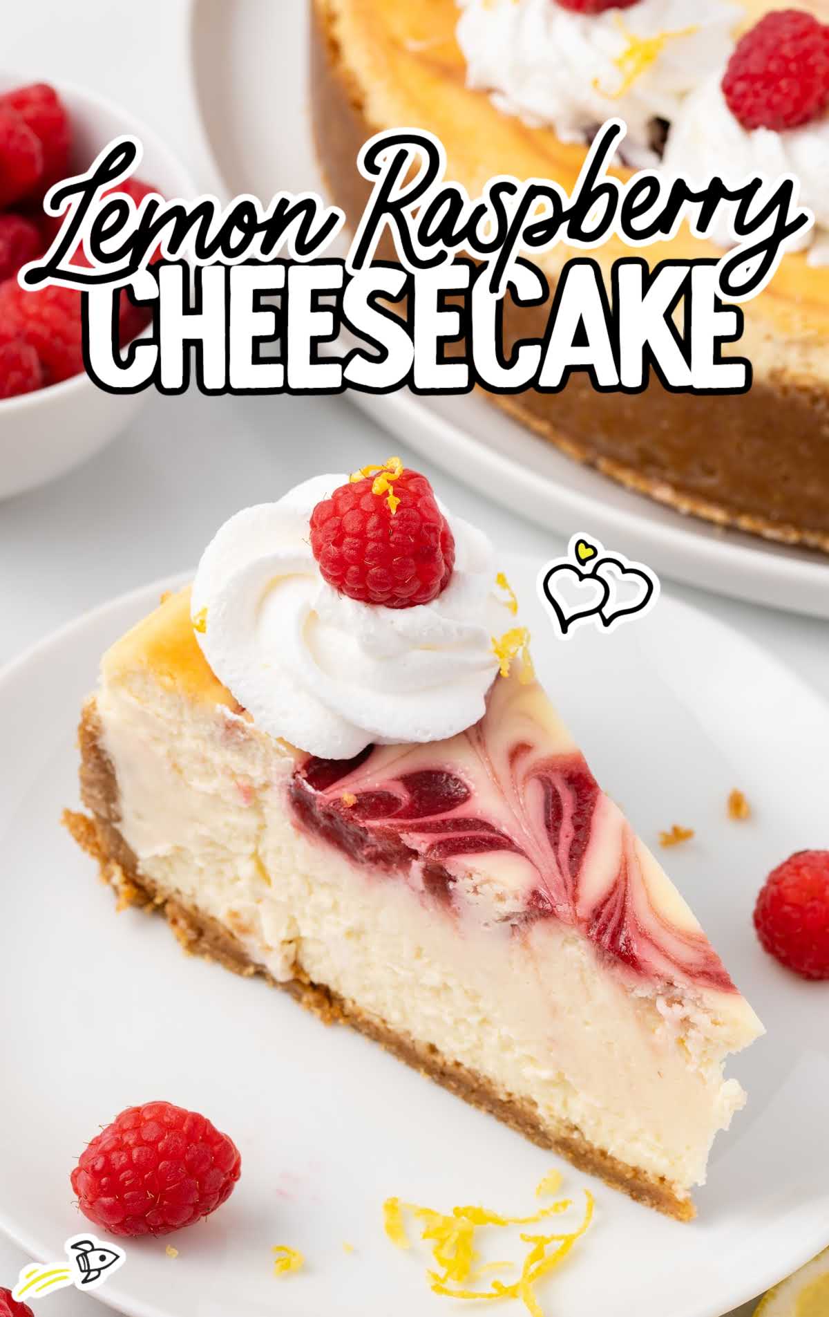 a overhead shot of a slice of Lemon Raspberry Cheesecake on a plate