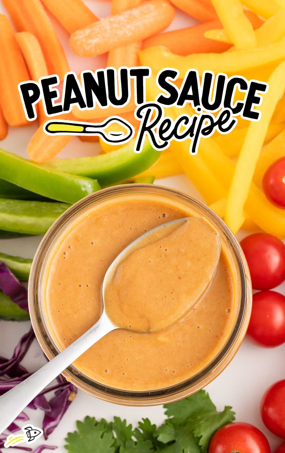 overhead shot of Peanut Sauce Recipe in a jar with a spoon