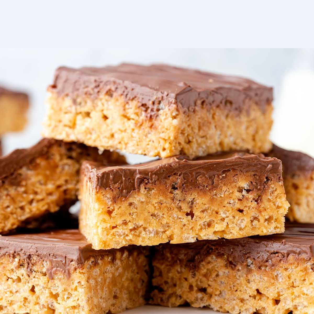 close up shot of scotcheroos stacked on top of each other