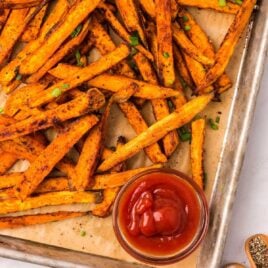 overhead shot of Sweet Potato Fries on a tray with a side of ketchup