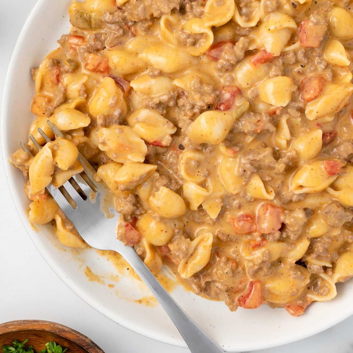 close up overhead shot of a plate of Taco Macaroni with a fork