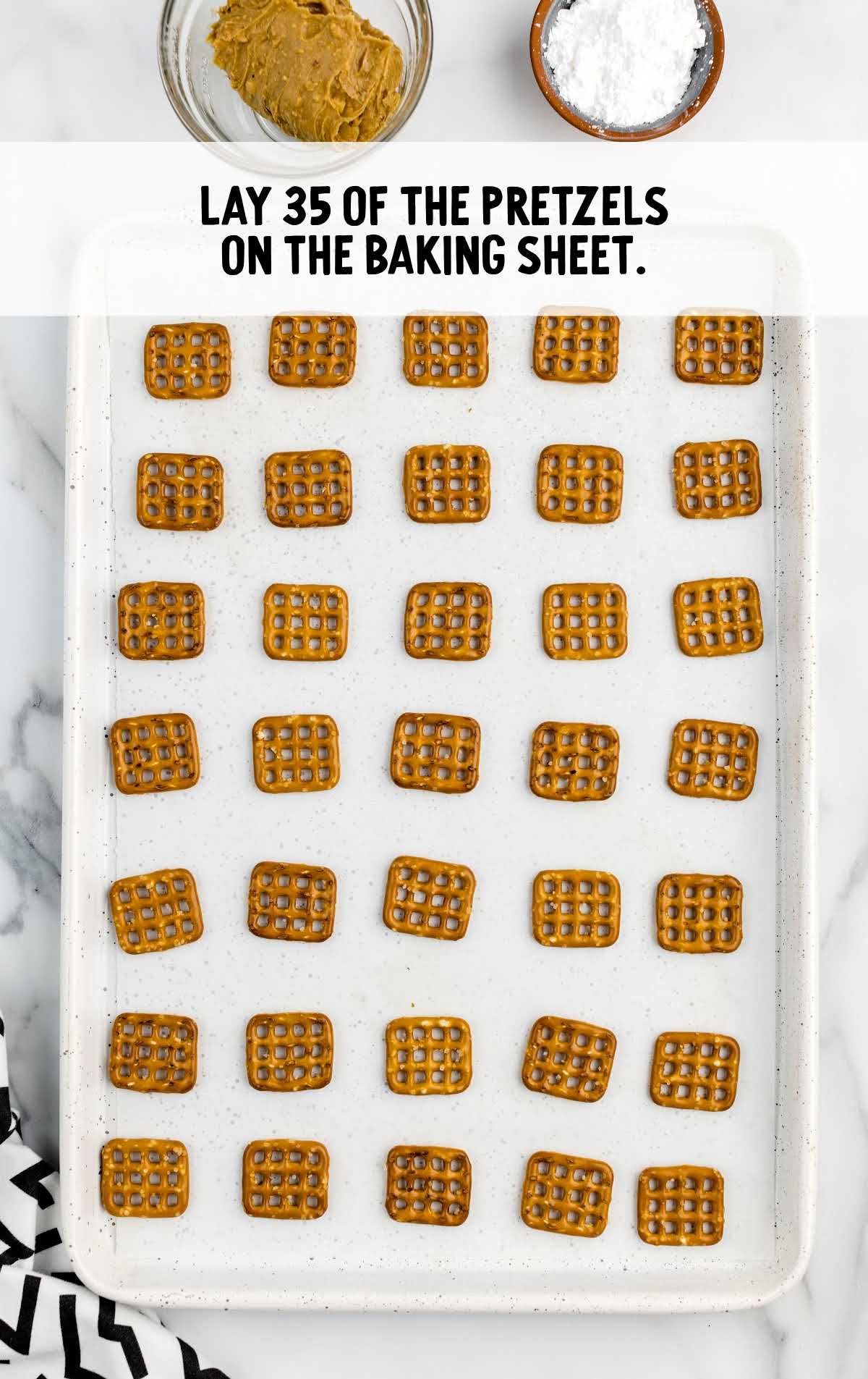 pretzels lined on a baking sheet