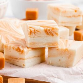 close up shot of White Chocolate Caramel Fudge pieces piled on top of each other