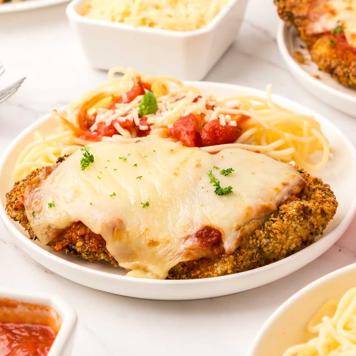 close up shot of Air Fryer Chicken Parmesan on a plate