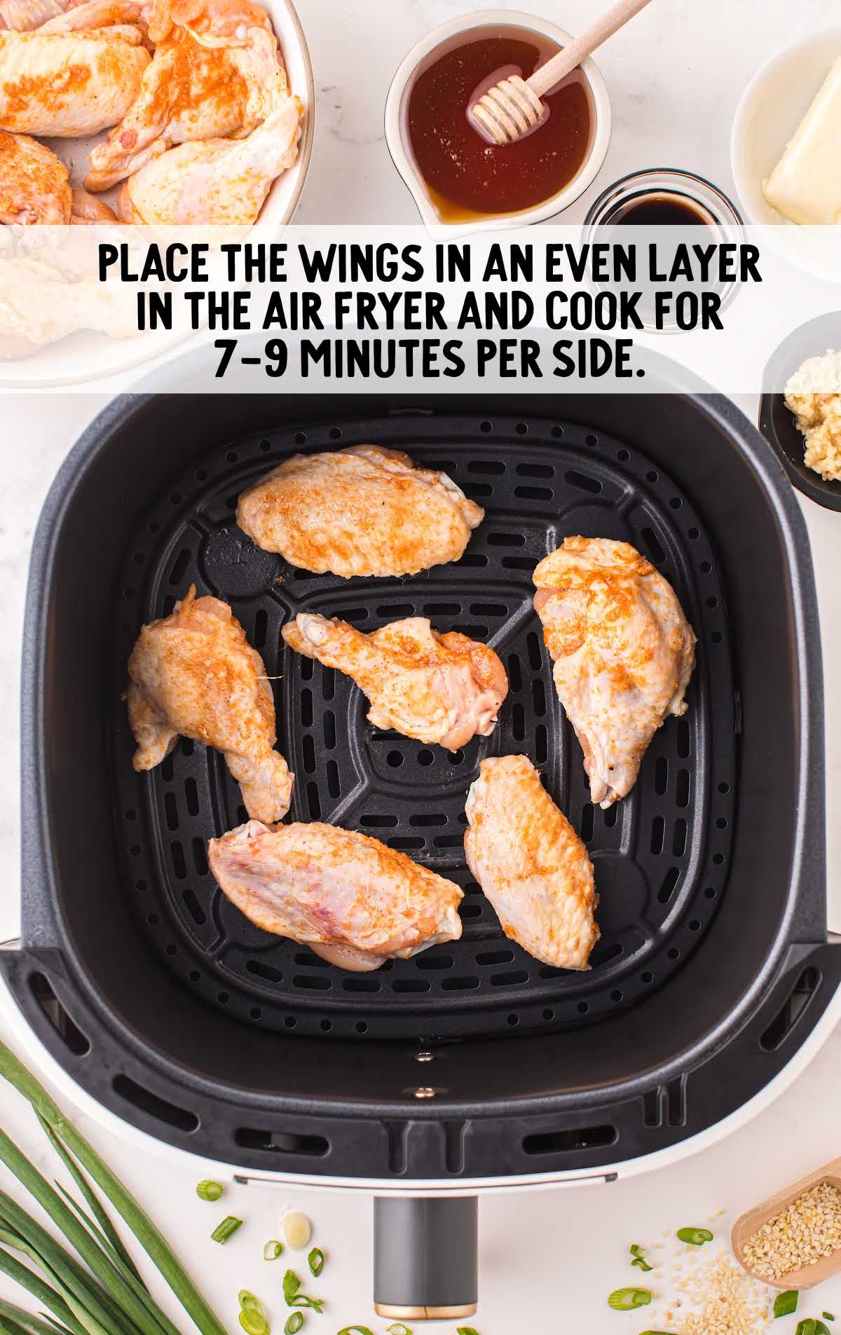 wings placed in the air fryer and cooked