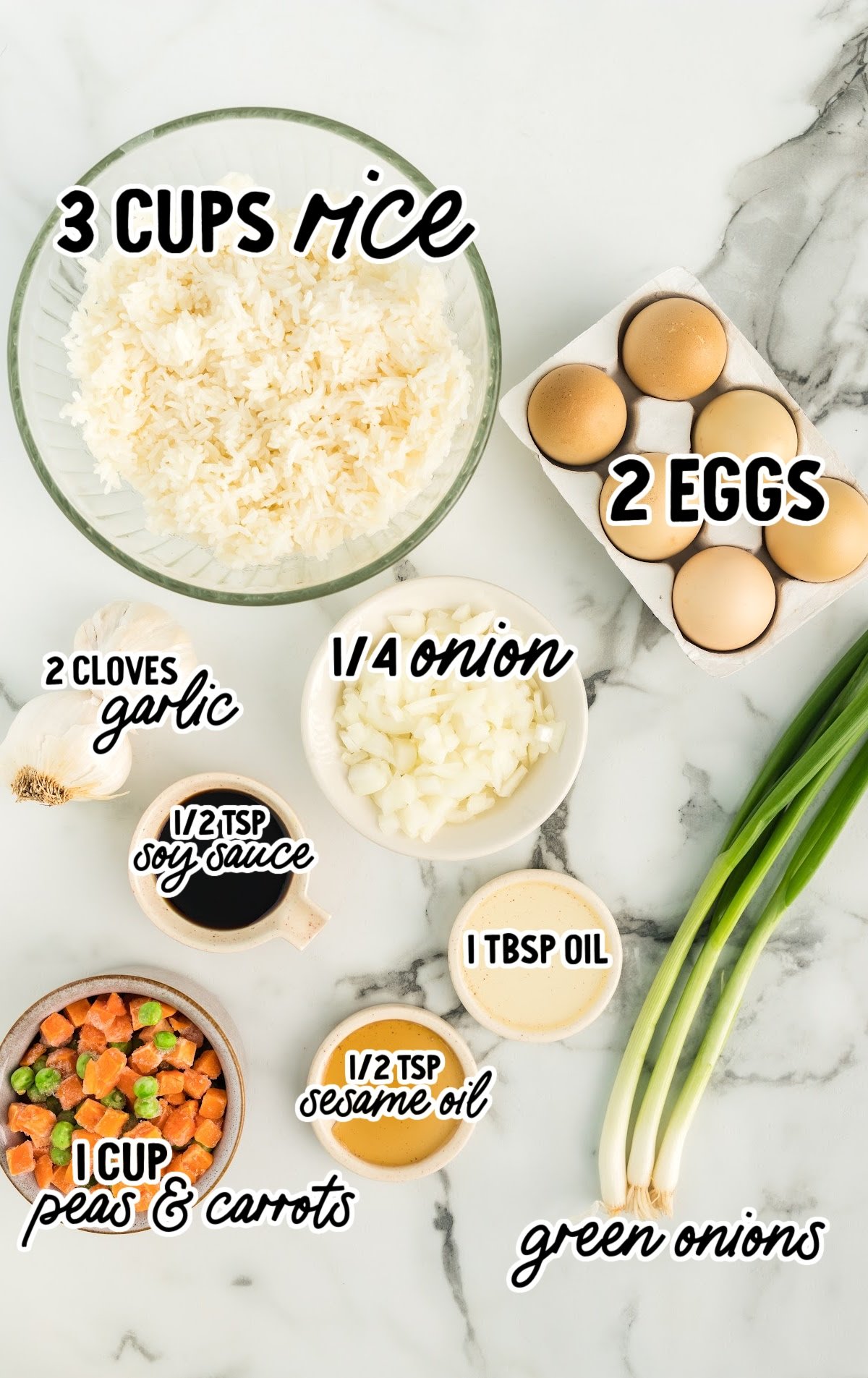 ingredients to make fried rice including a bowl of cooked rice, eggs, and veggies