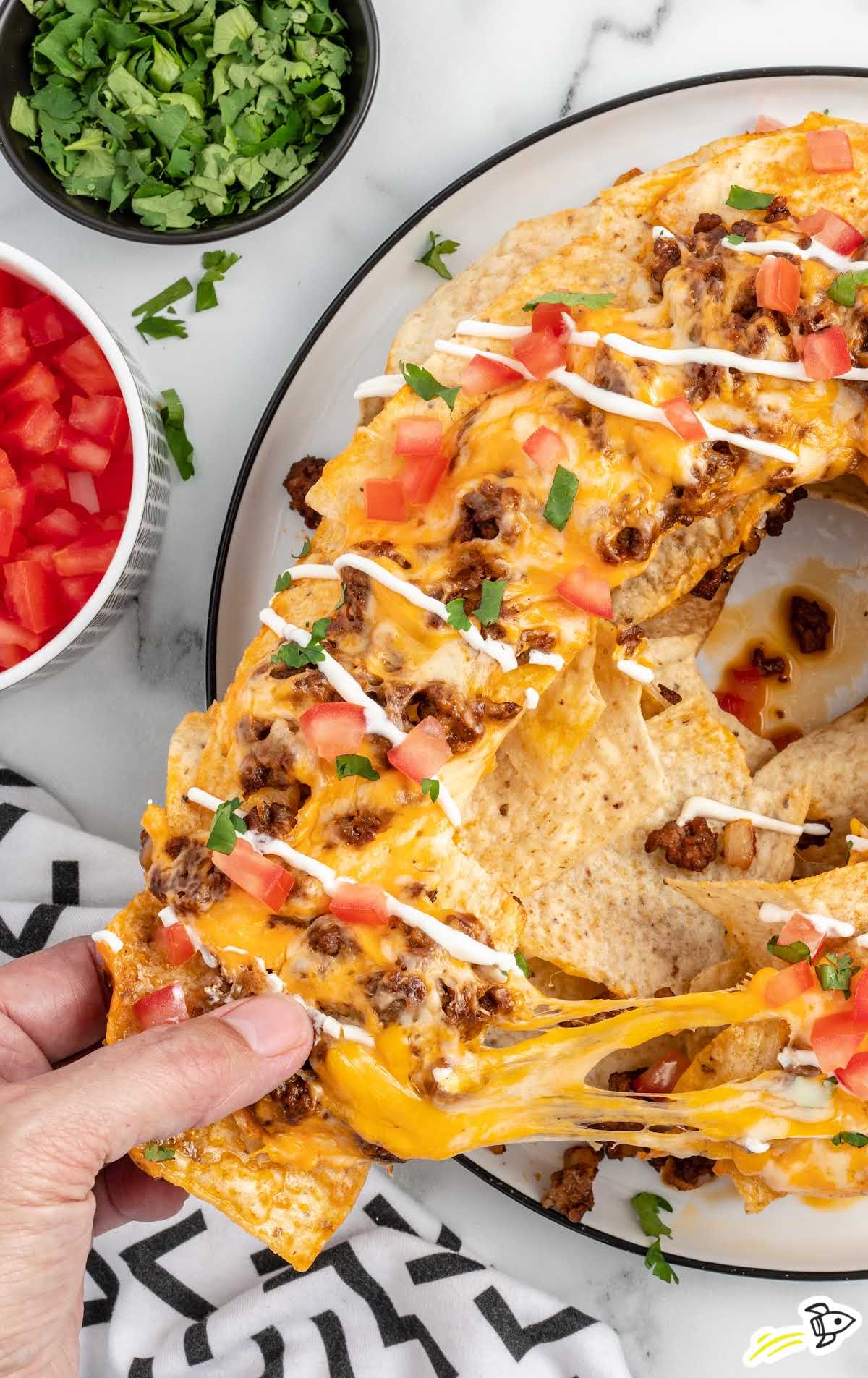 overhead shot of nachos on a plate