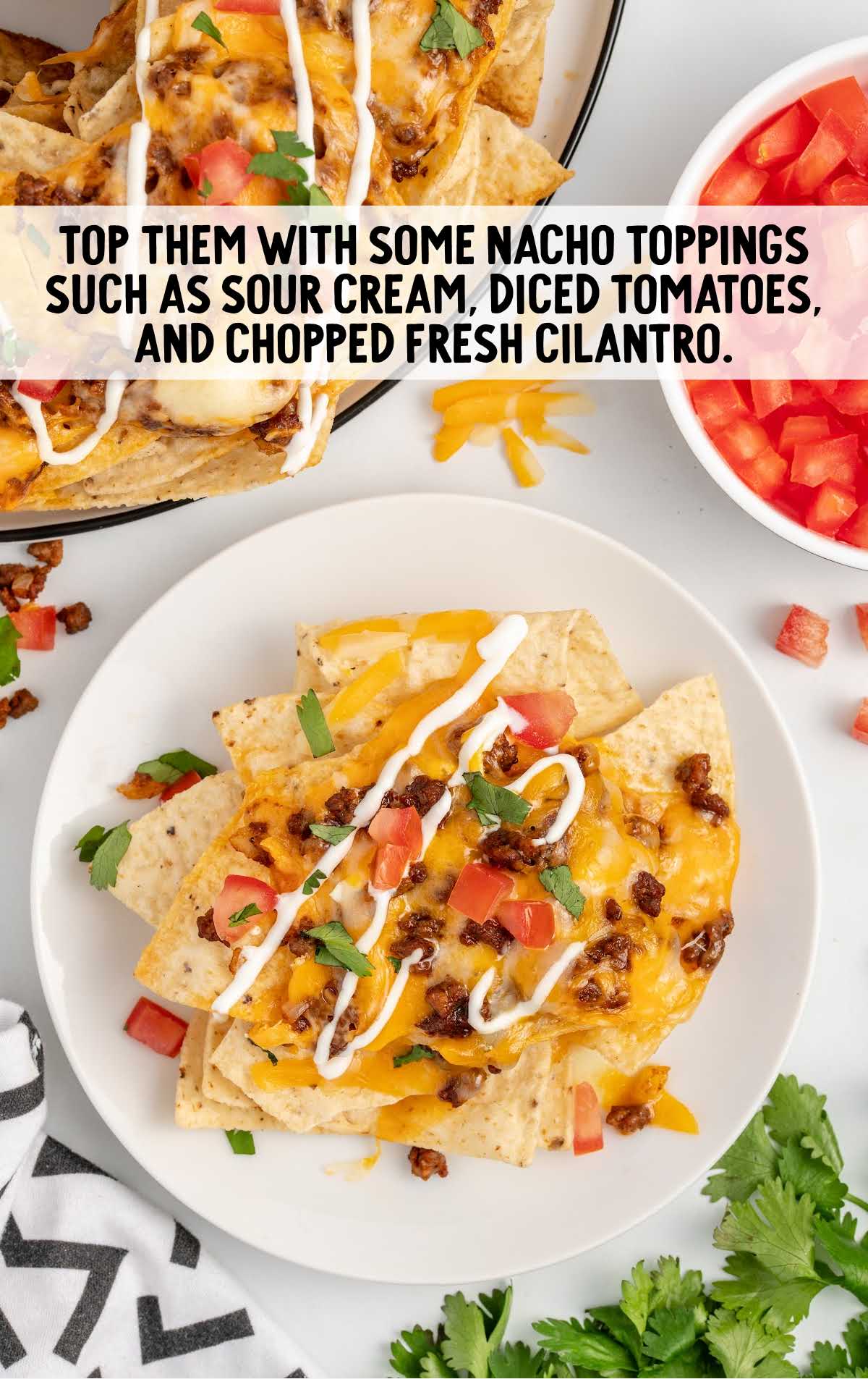 nachos topped with toppings on a plate