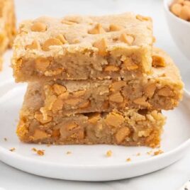 close up shot of Butterscotch Bars stacked on top of each other on a plate