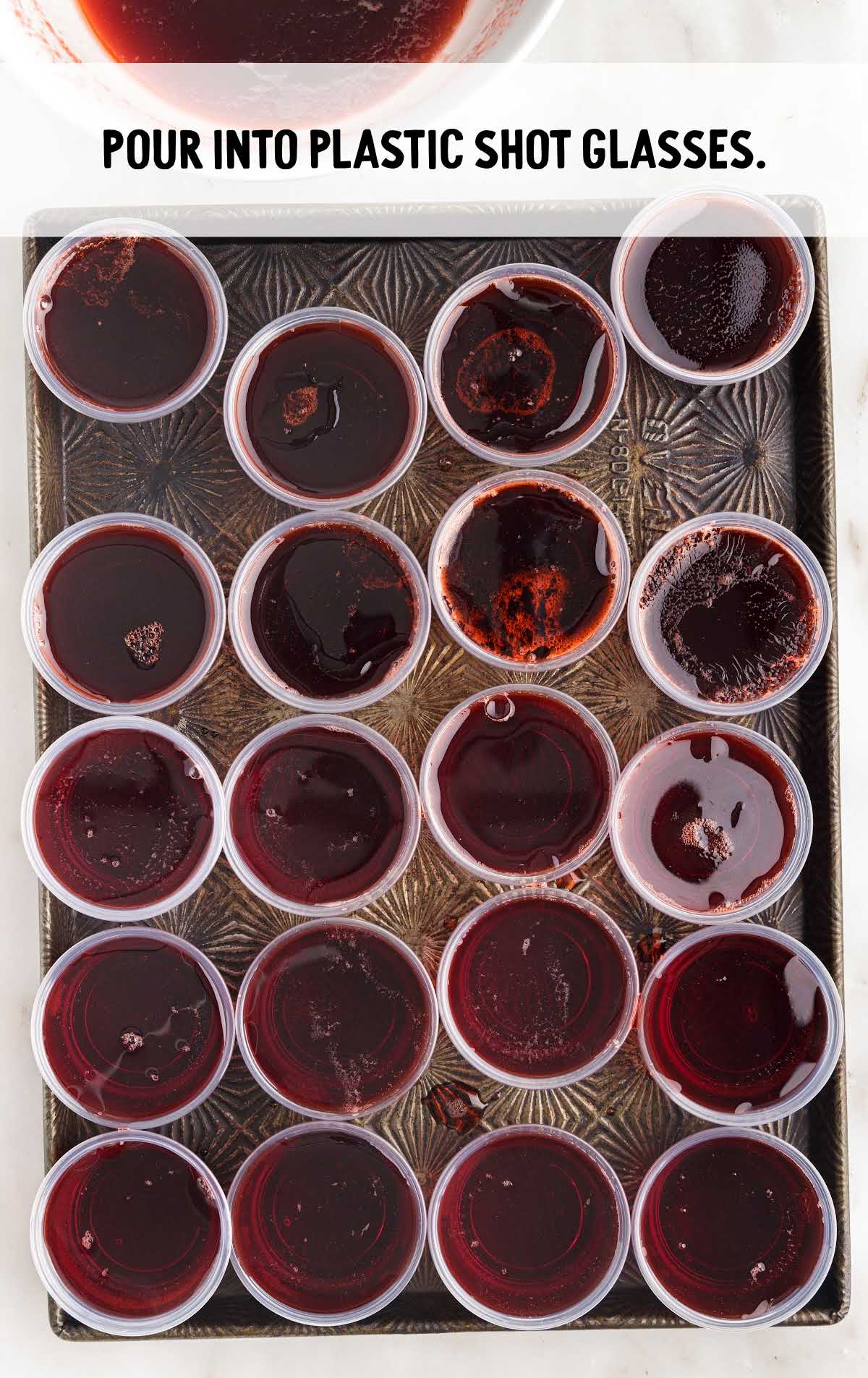 jello mixture poured into shot cups