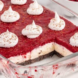 a close up shot of Chocolate Raspberry Cheesecake Delight on a baking dish