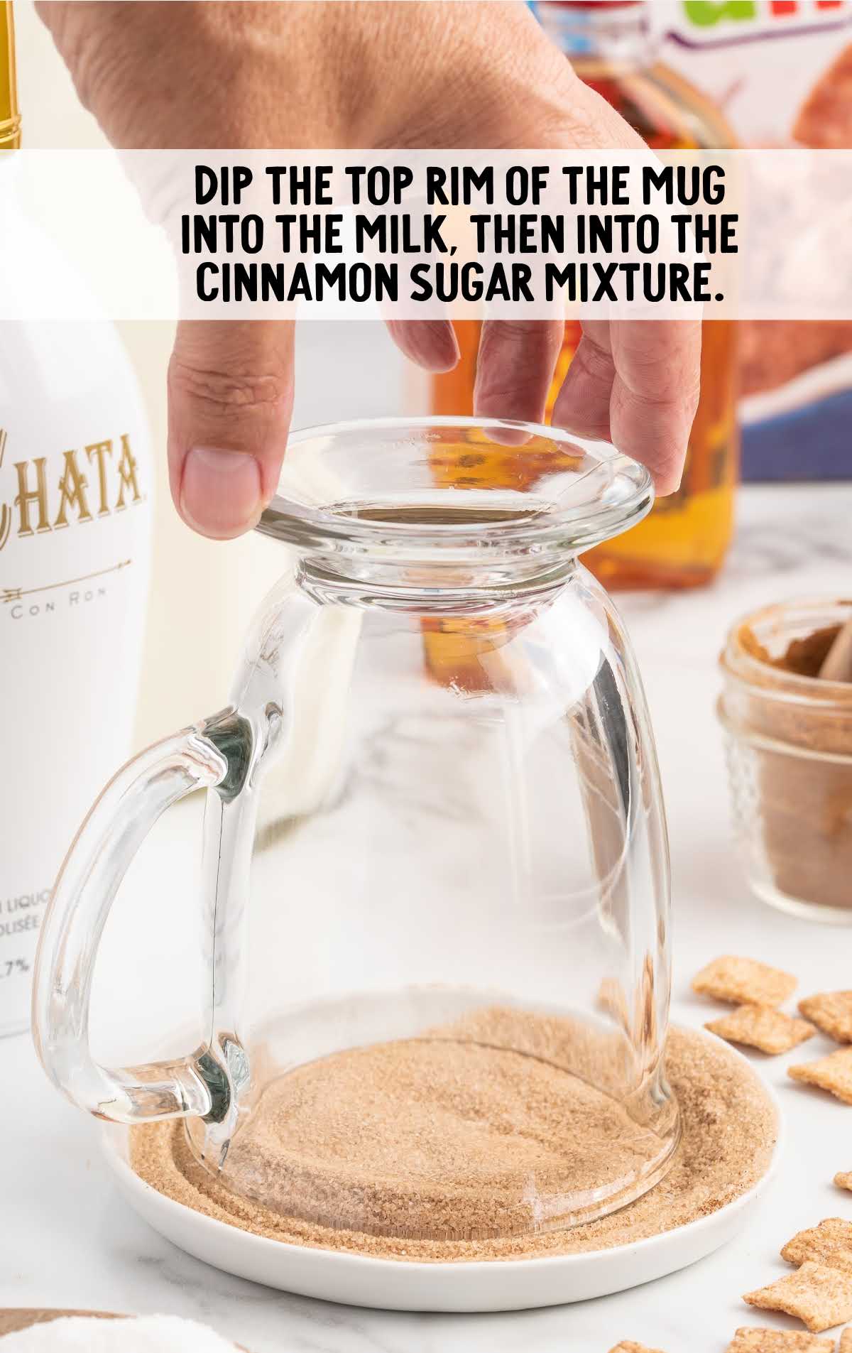 rim dipped into the milk and then cinnamon sugar mixture