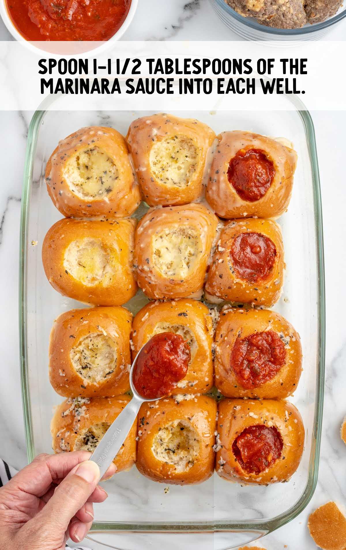 marinara sauce sprinkled on top of the Garlic Bread Meatballs