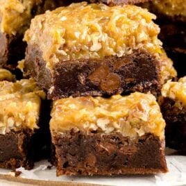 close up shot of German Chocolate Brownies stacked on top of each other on a tray