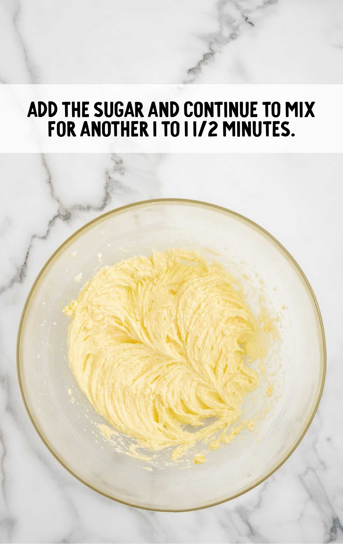 sugar added to the butter mixture in a bowl