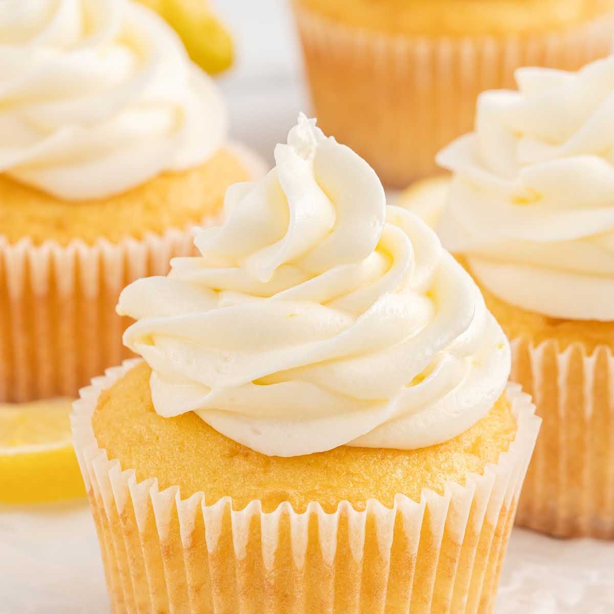 close up shot of cupcakes topped with Lemon Cream Cheese Frosting