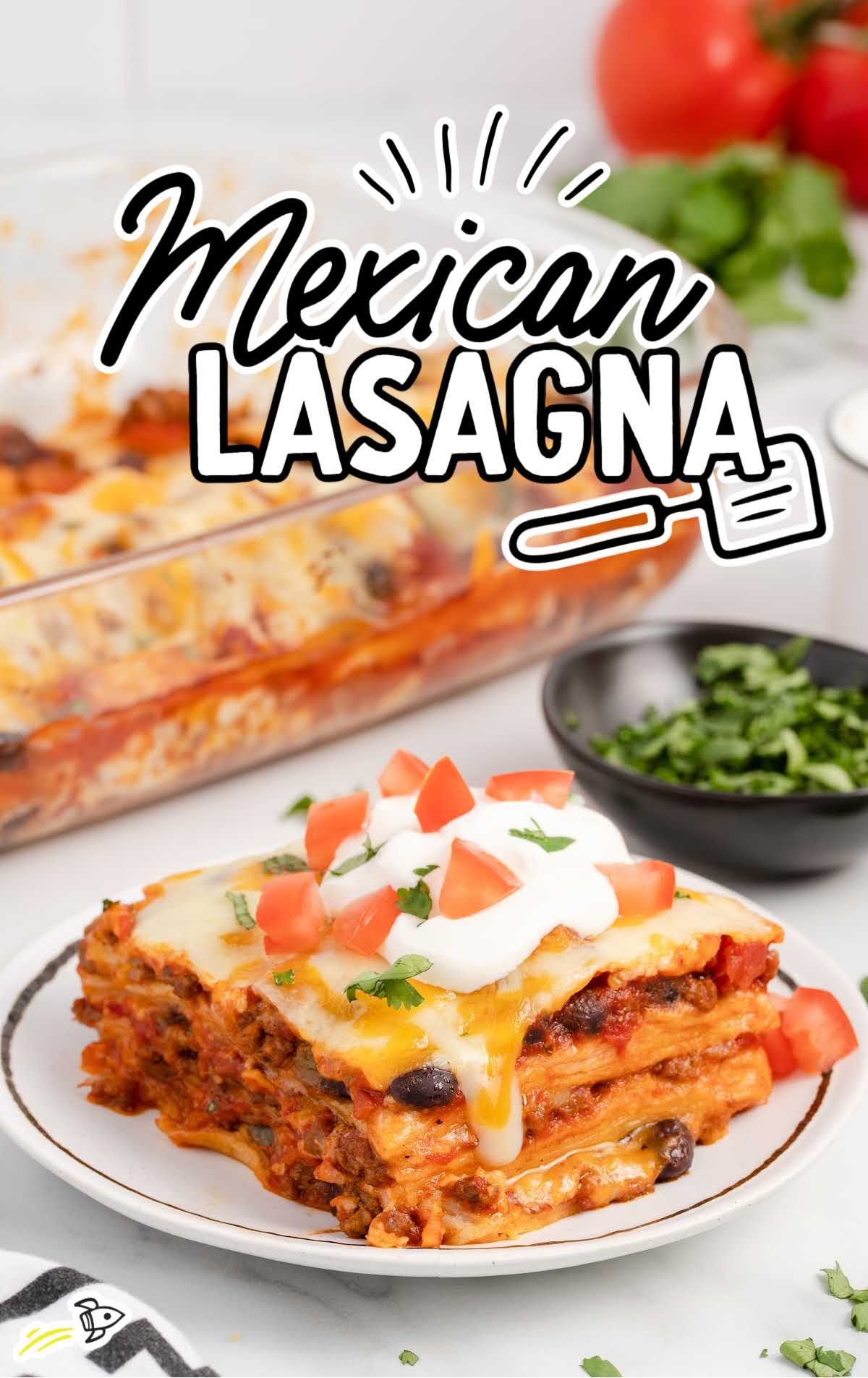 a close up shot of a slice of Mexican Lasagna on a plate