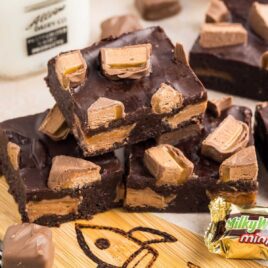 a close u shot of Milky Way Brownies stacked on top of each other
