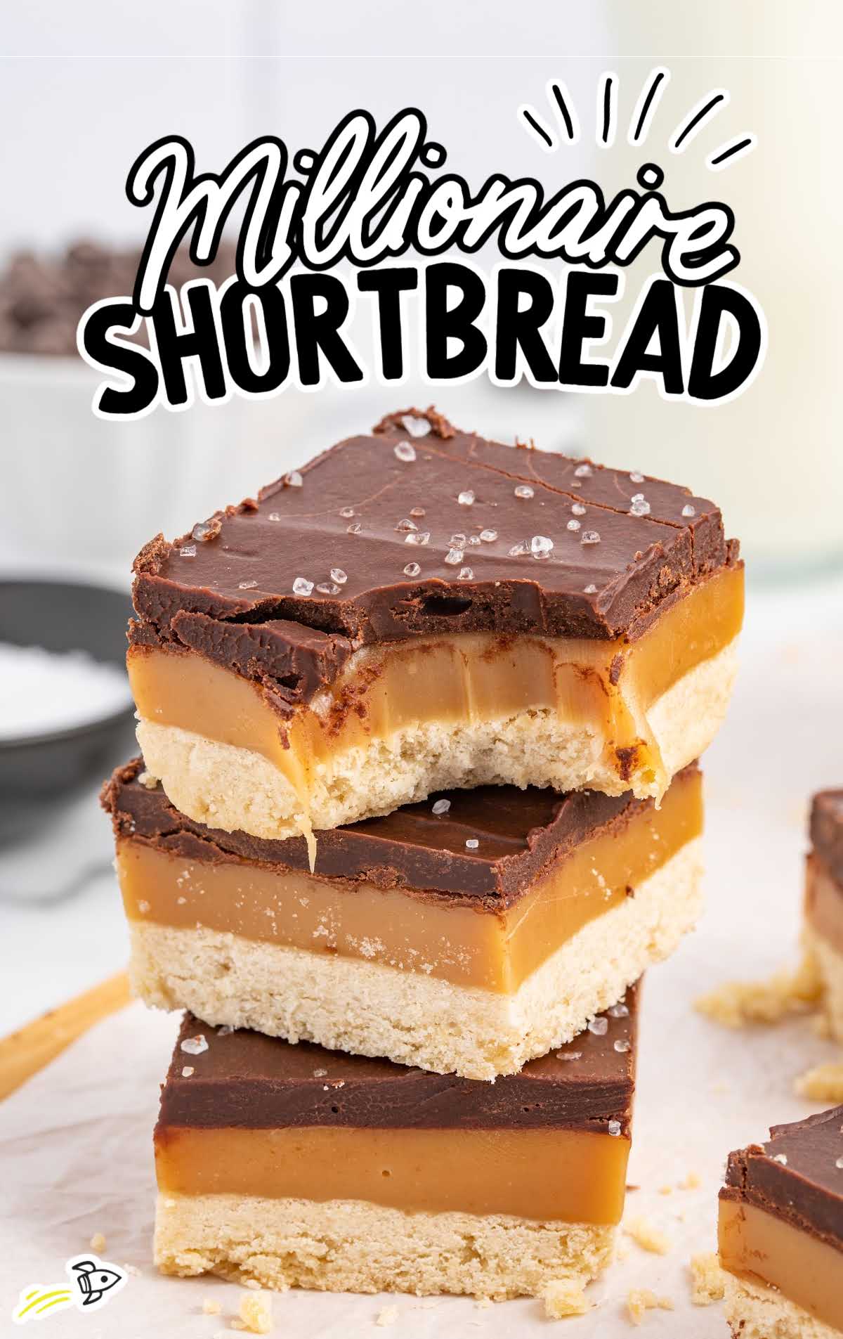 close up shot of Millionaire Shortbread stacked on top of each other with one having a bite taken out of it