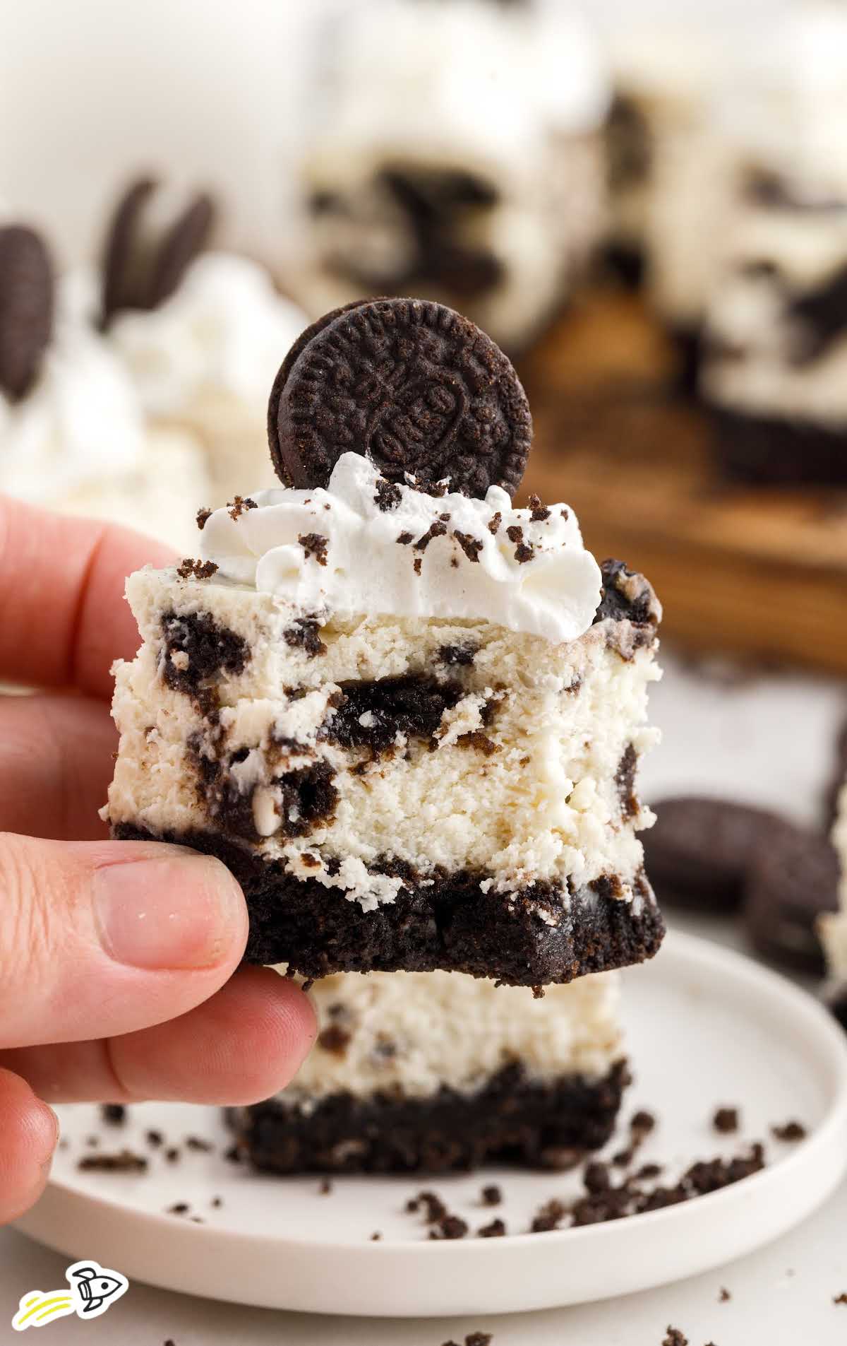 close up shot of a Oreo Cheesecake Bite with a bite taken out of it