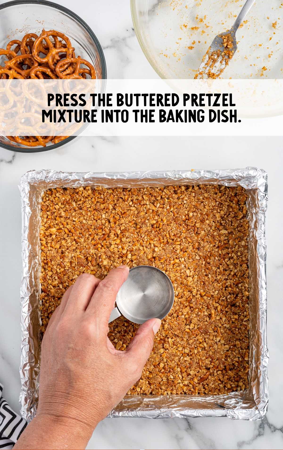 butter pretzel mixture pressed into the baking dish