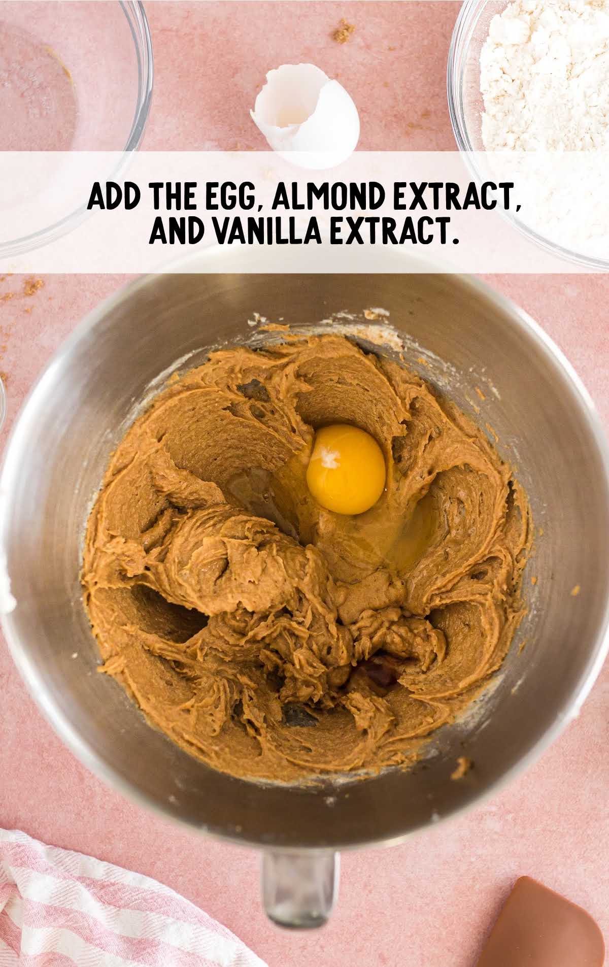 eggs, almond extract, and vanilla extract combined in a bowl