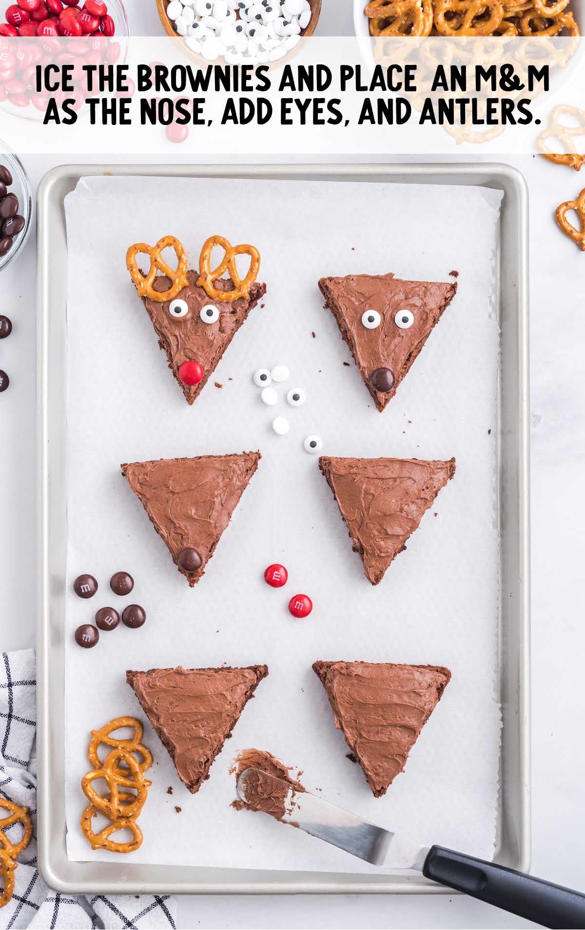 brownies iced and m&M placed as nose and eyes add pretzel for antlers 
