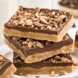 a close up shot of Toffee Bars stacked on top of each other