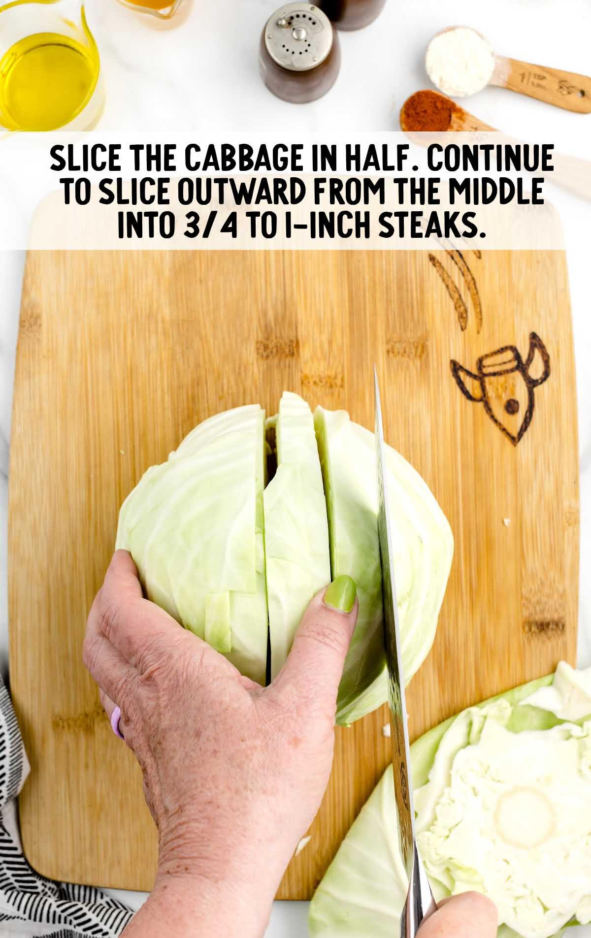 cabbage cut in half on a wooden board
