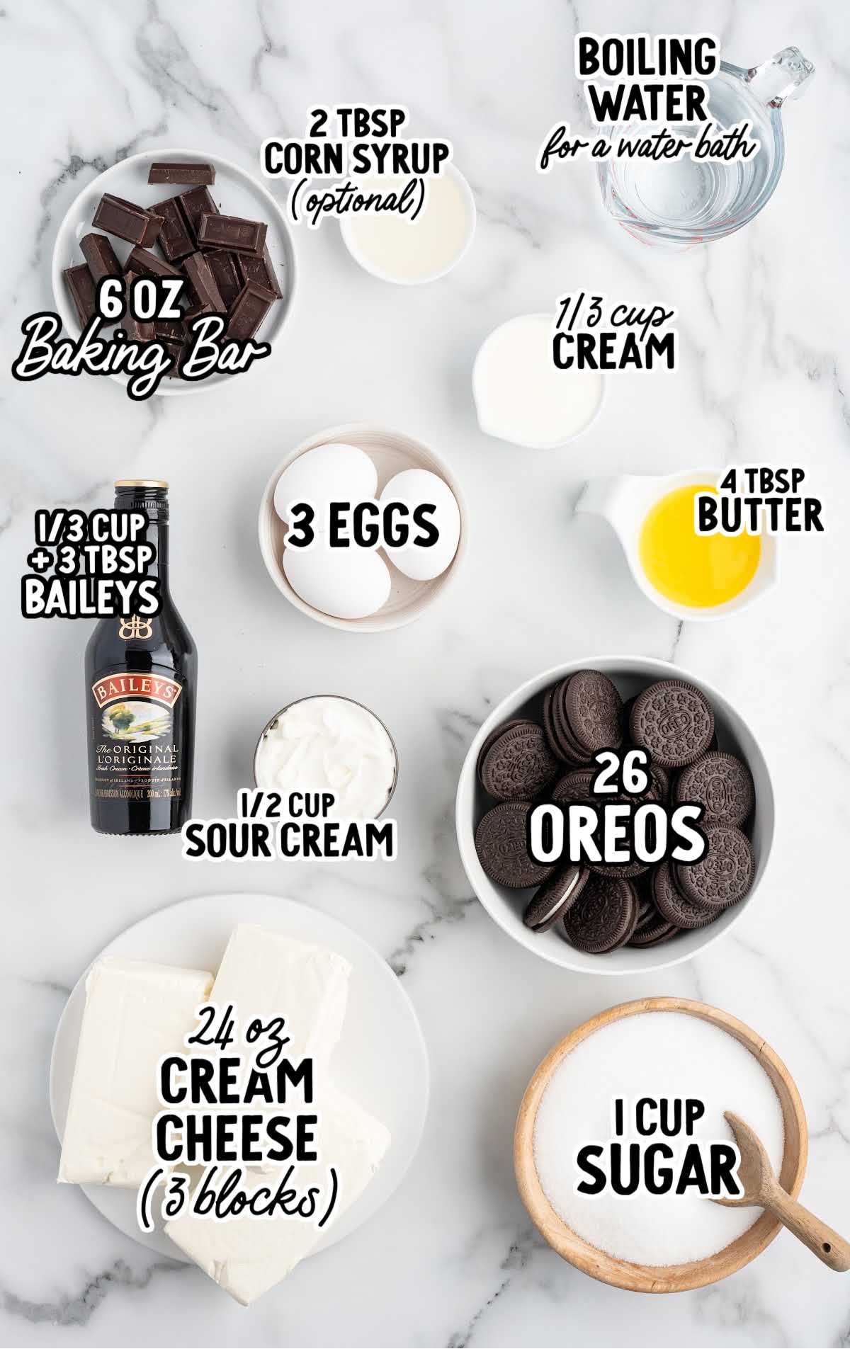 Labeled ingredients for Baileys cheesecake including Oreos, cream cheese, Baileys liqueur, eggs, sugar, sour cream, butter, and chocolate.