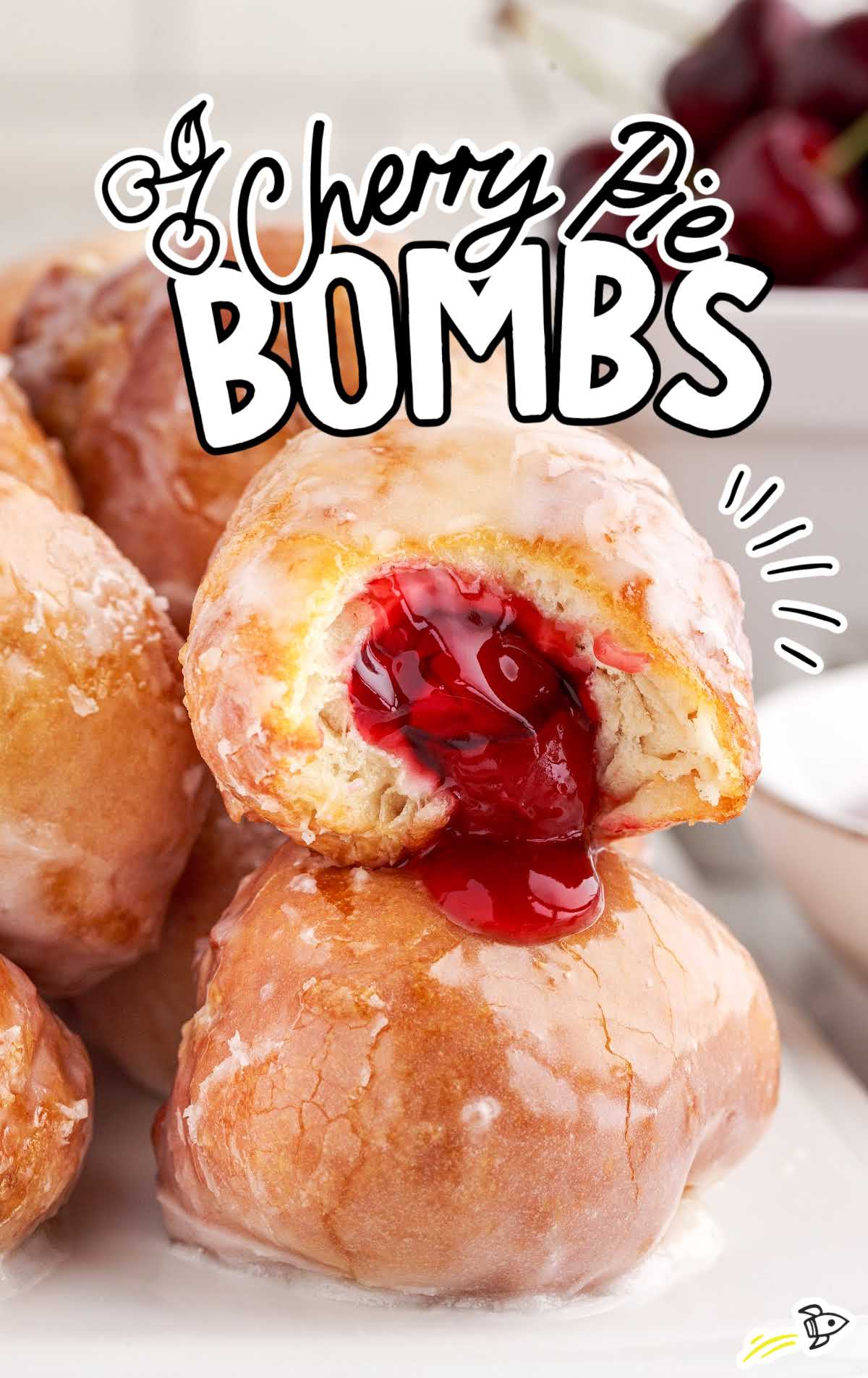 close up shot of Cherry Pie Bombs with a bite taken out of one of the bombs