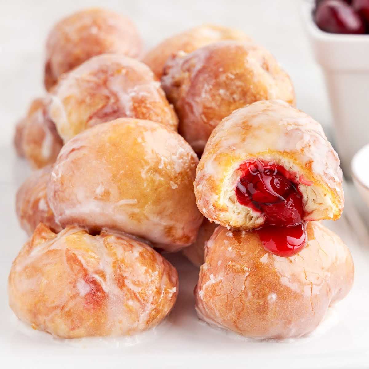 close up shot of Cherry Pie Bombs with a bite taken out of one of the bombs