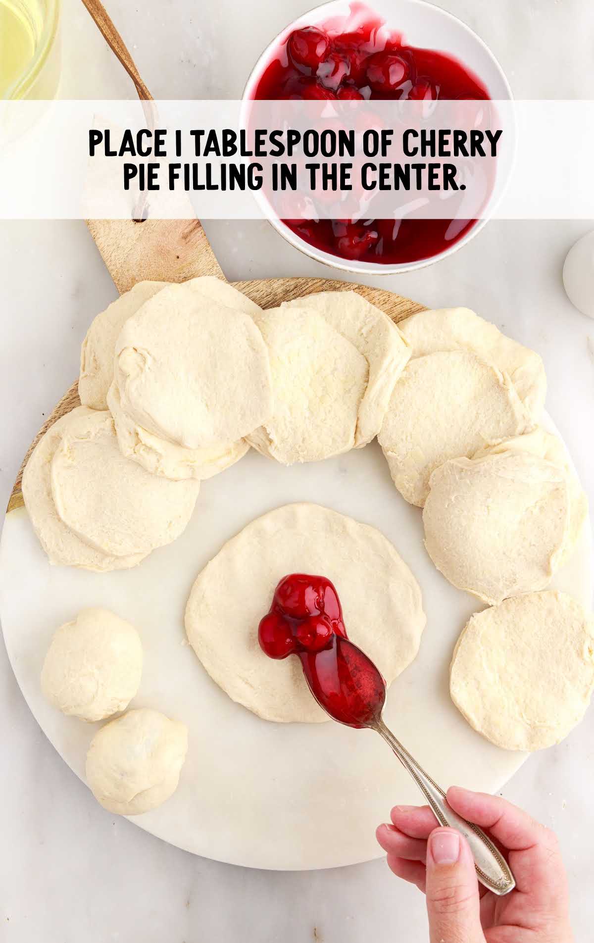 cherry pie filling placed into the center of the dough