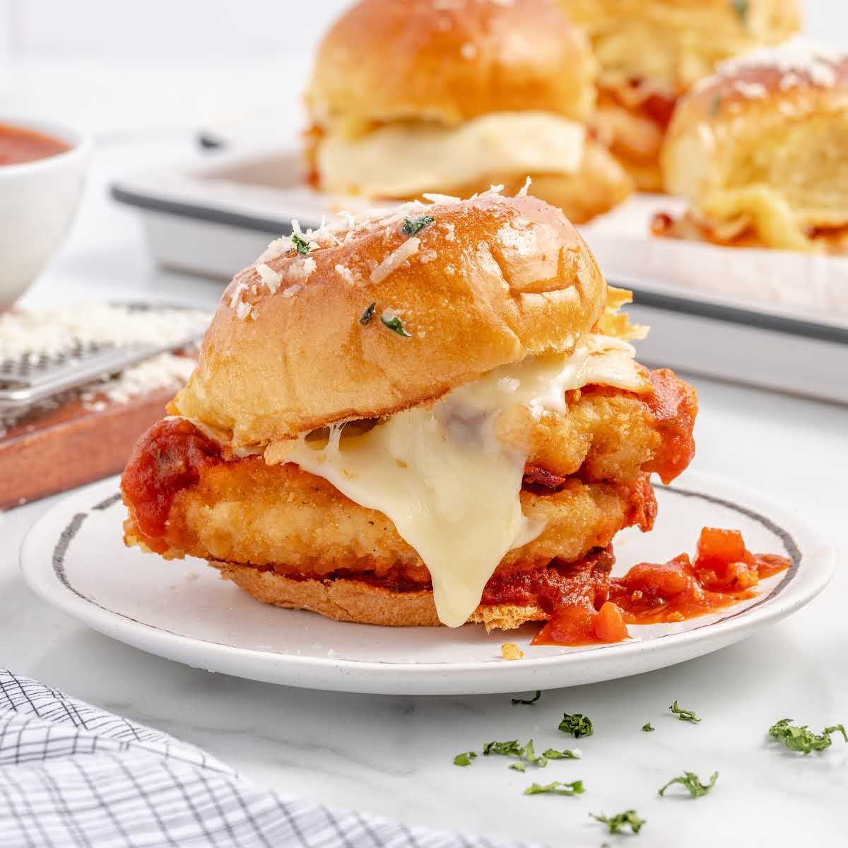 close up shot of a Chicken Parmesan Slider on a plate