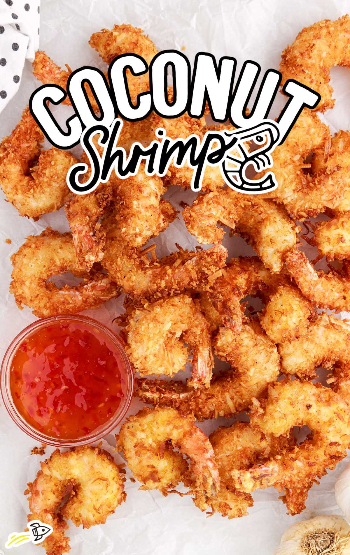 a bunch of Coconut Shrimp with a bowl of tarter sauce