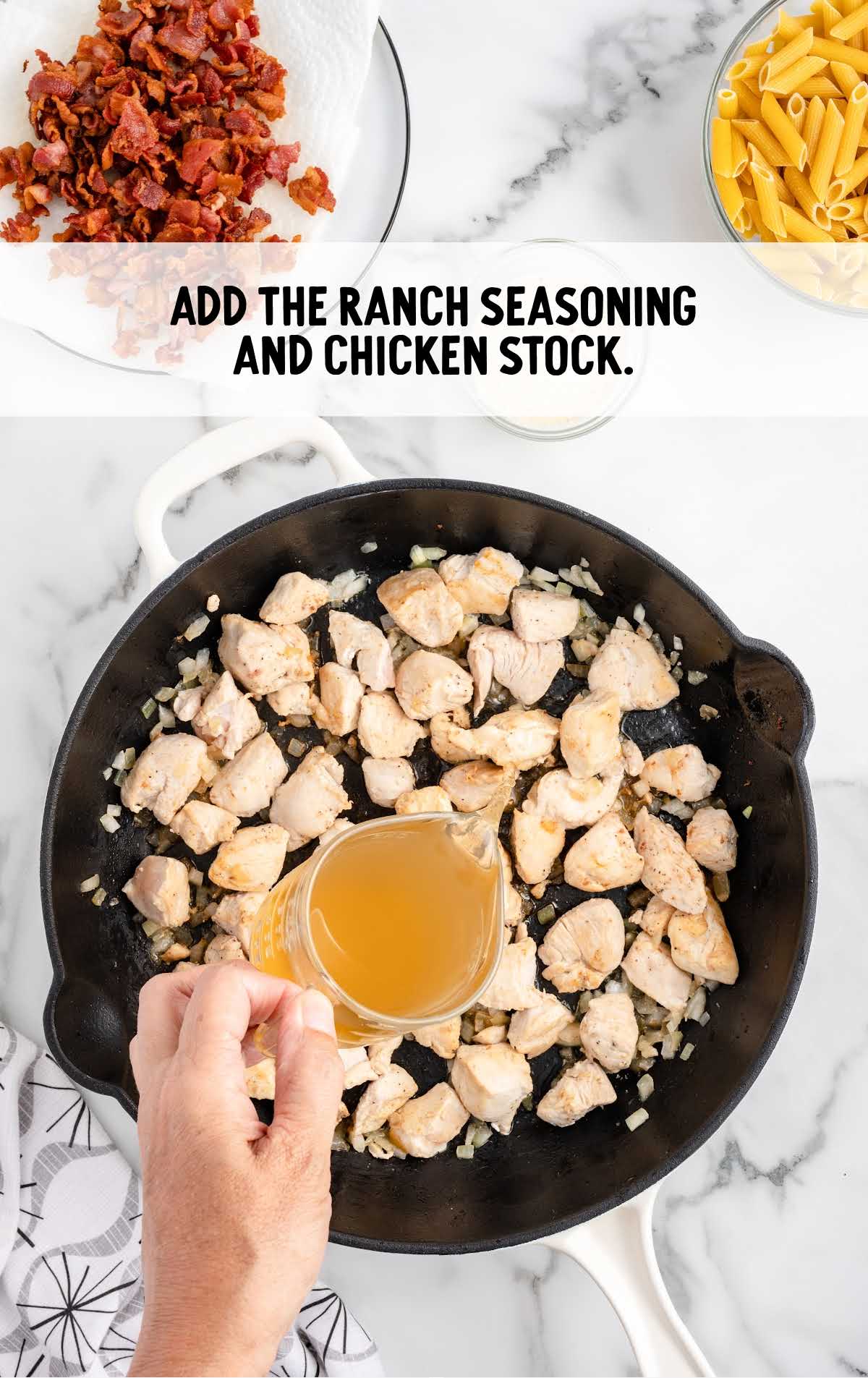 ranch seasonings and chicken stock added to the skillet