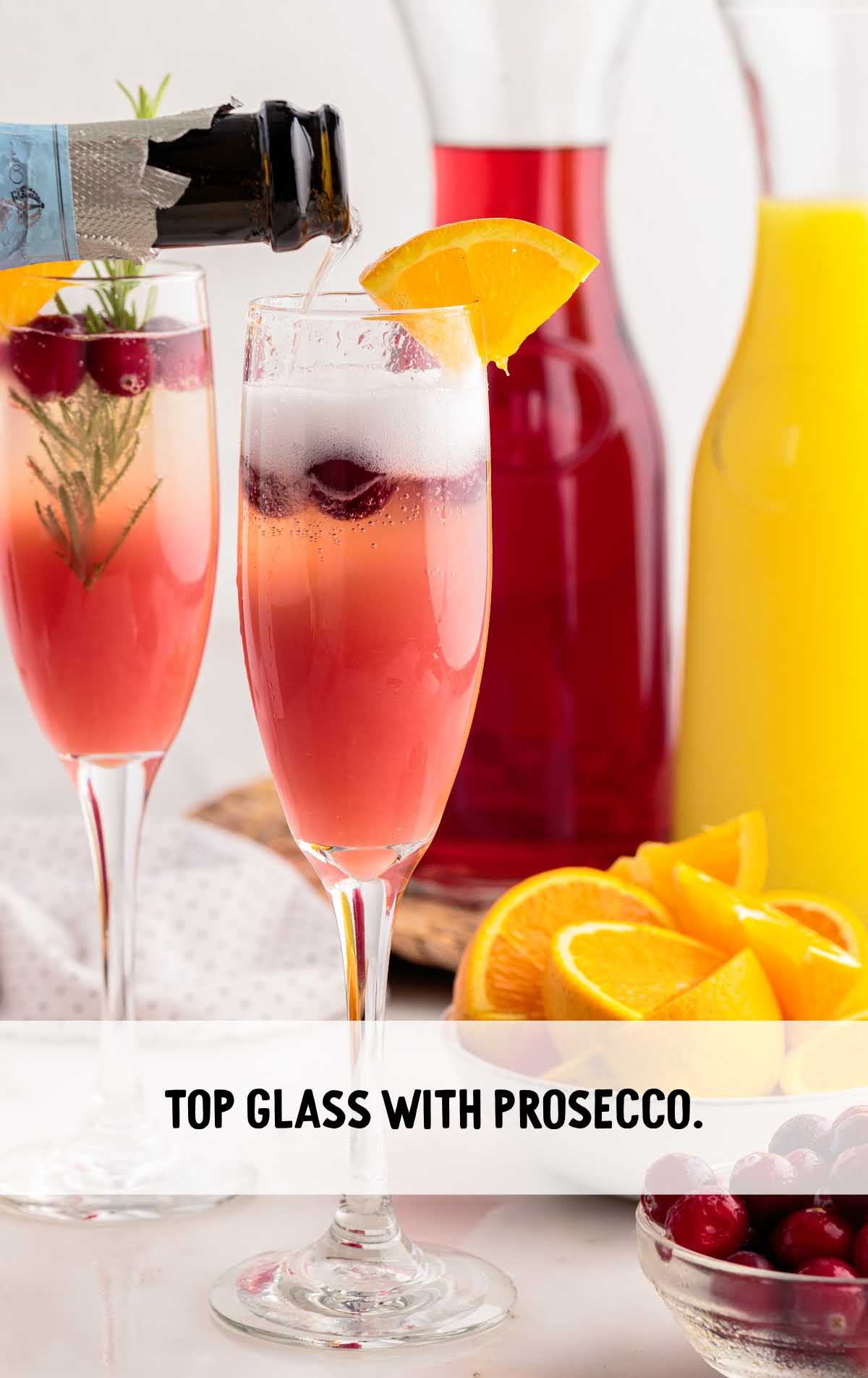 glass topped with prosecco