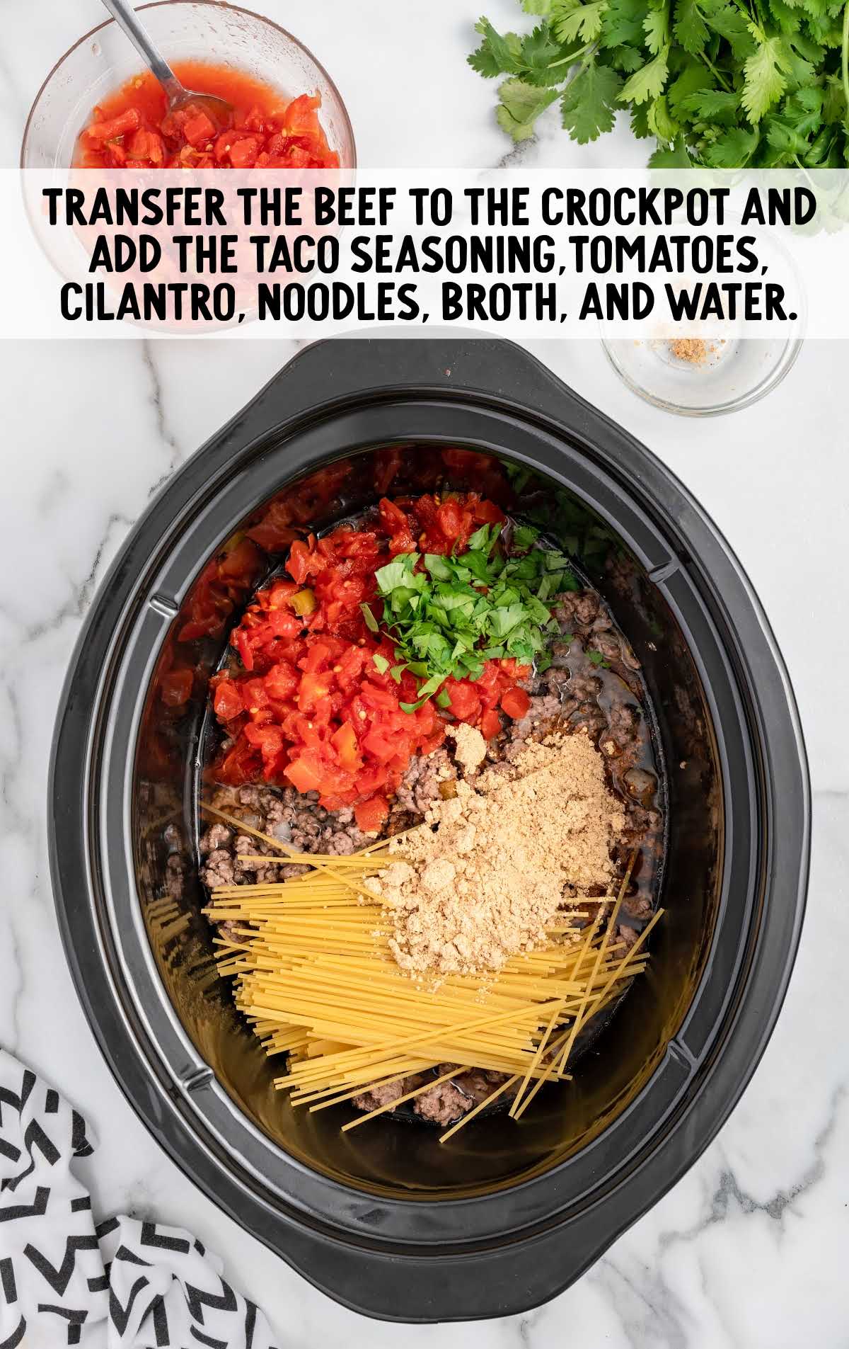 ground beef mixture, taco seasoning, Rotel tomatoes, cilantro, spaghetti noodles, beef broth, and water added to a crockpot