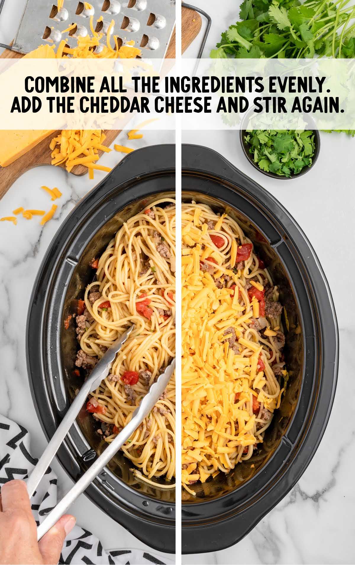 cheddar cheese added to the crockpot of spaghetti