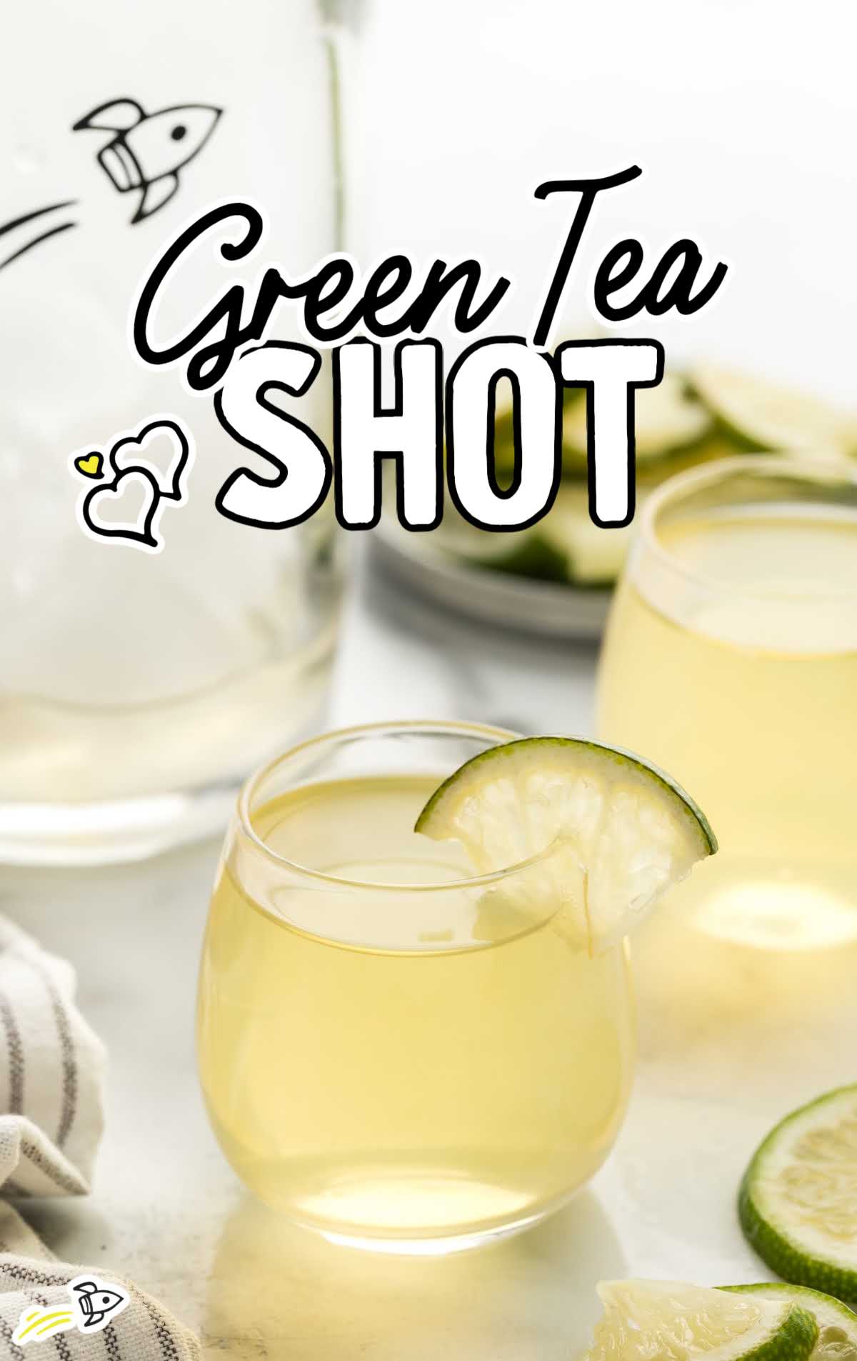 a close up shot of Green Tea Shot in a glass cup garnished with a slice of lime