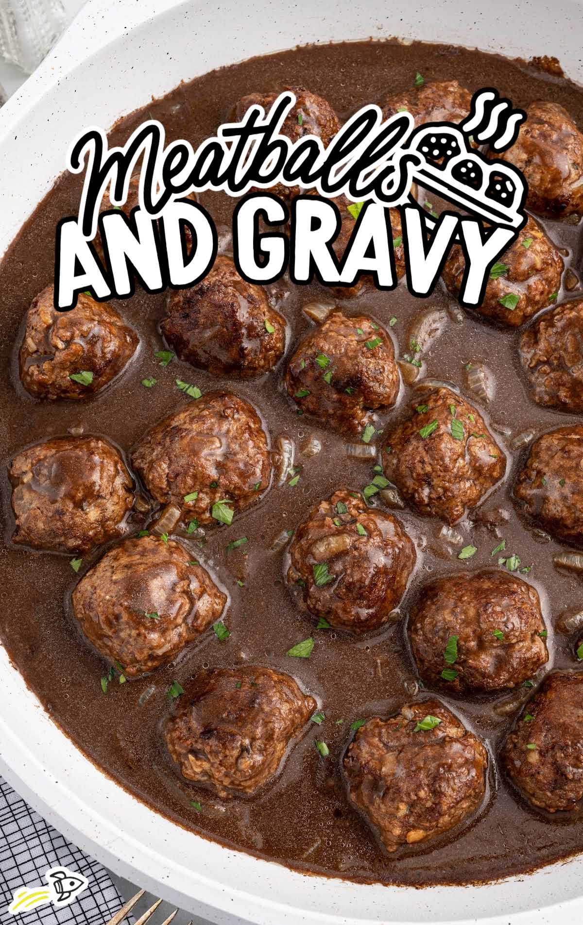 a pot of Meatballs and Gravy garnished with parsley