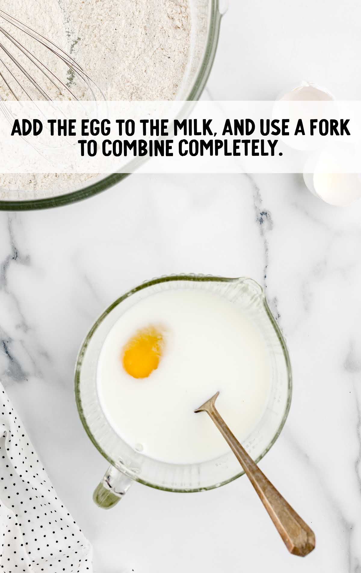eggs and milk combined in a measuring cup
