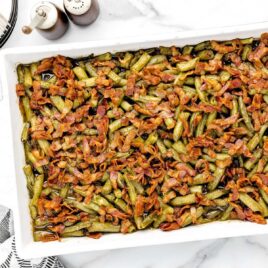 overhead shot of a baking dish of Smothered Green Beans with bacon