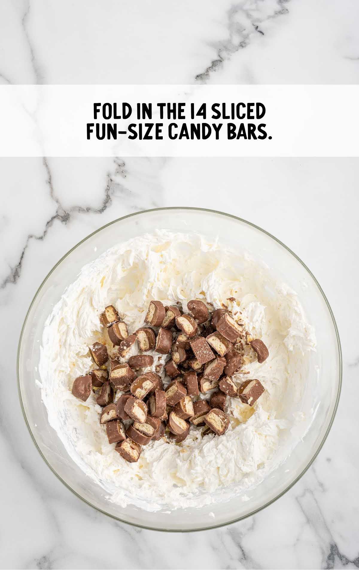 slices of candy bar folded into the cream cheese mixture